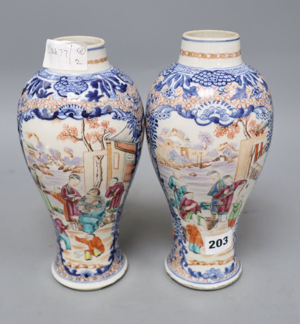 A pair of 18th century Chinese famille rose figural vases, height 25.5cm